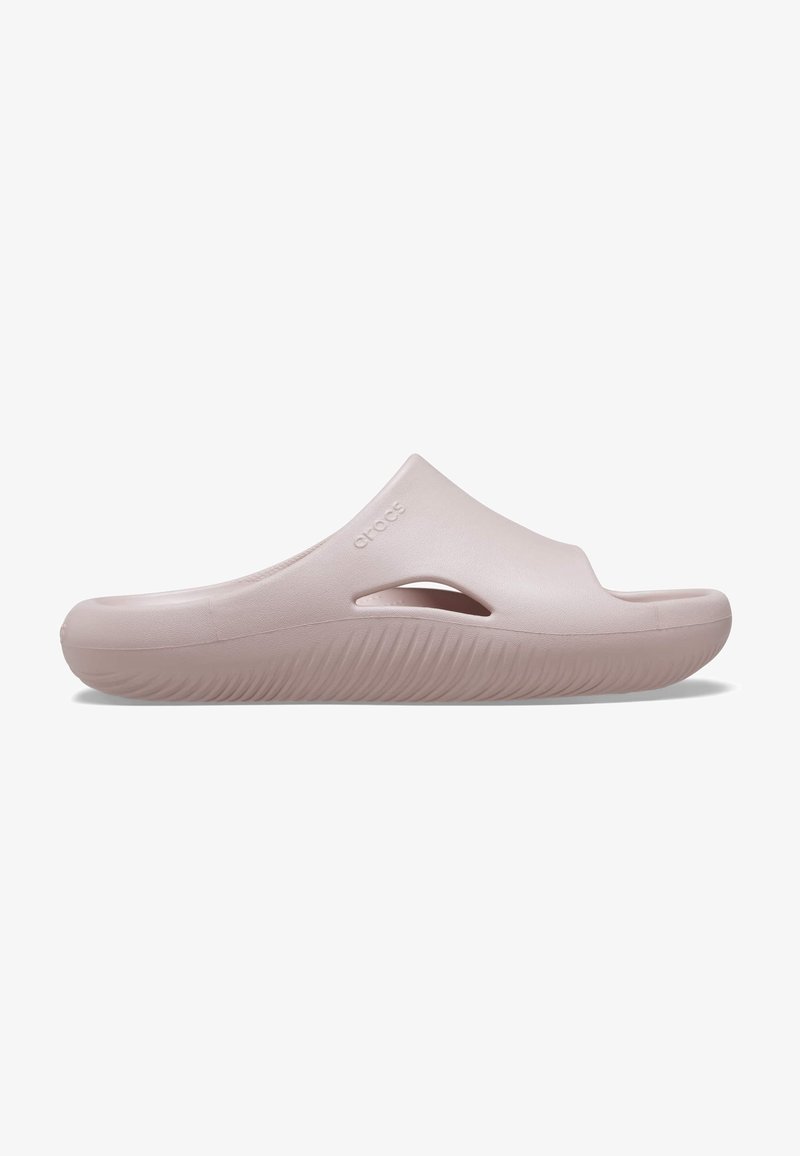 Sabot rose clair à enfiler avec semelle épaisse, ouverture latérale de ventilation et surface supérieure lisse, conçu pour un usage décontracté et le confort.