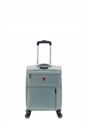 Valise de cabine vert clair avec coque rigide, deux zips avant, une poignée supérieure, un trolley rétractable en aluminium et quatre roues pivotantes noires.