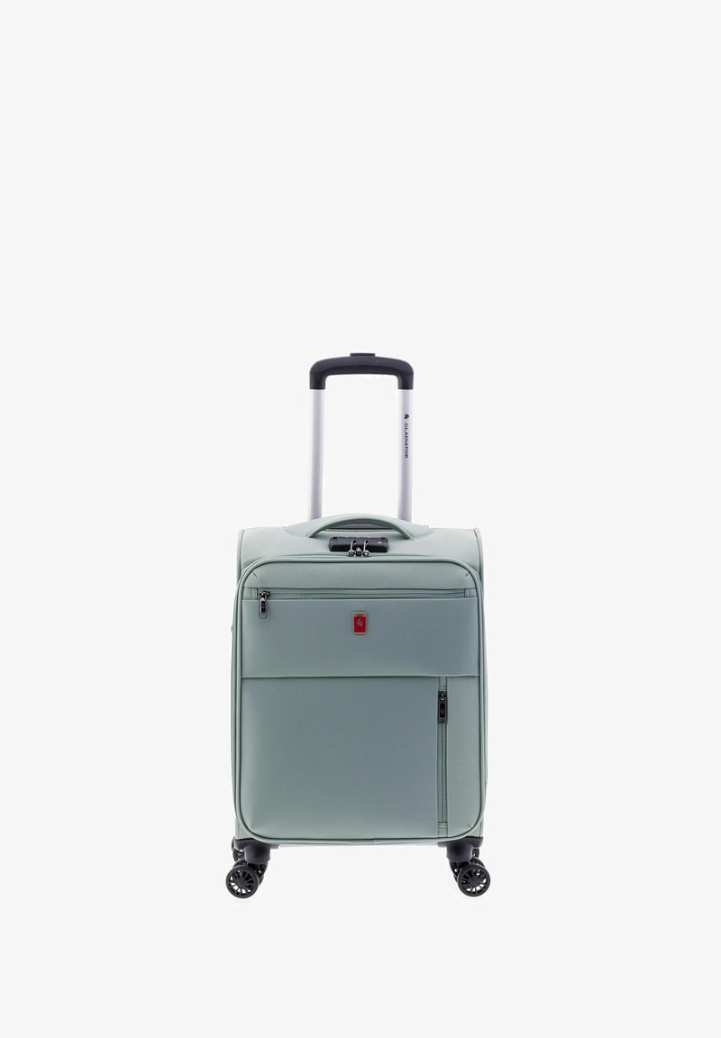 Valise de cabine vert clair avec coque rigide, deux zips avant, une poignée supérieure, un trolley rétractable en aluminium et quatre roues pivotantes noires.
