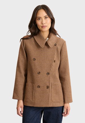 Bruine houndstooth-patroon dubbele-breasted jack met een grote kraag en vier bruine knopen. Bevat twee voorknoopzakken en heeft een ontspannen pasvorm.