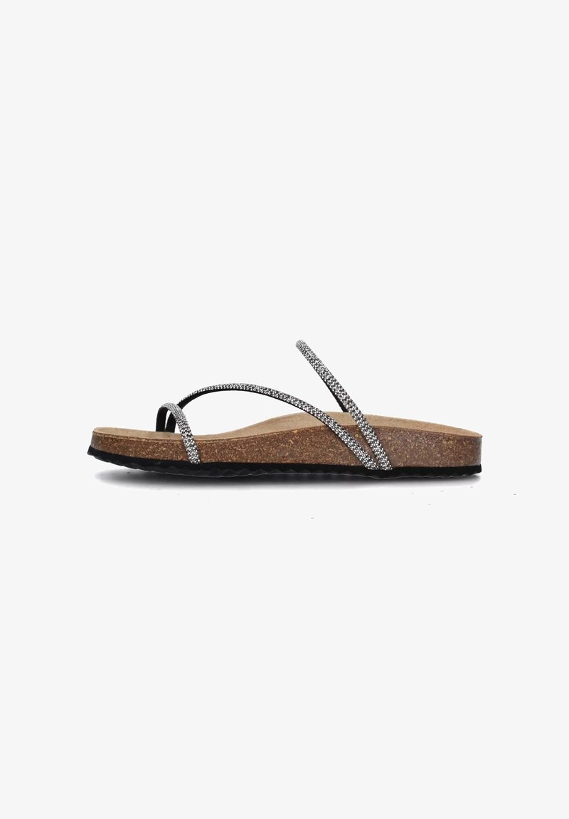 Chanclas de espuma de color negro y plateado con brillo, con una media suela de corcho y suela exterior de goma texturizada. Presentan tiras finas entrecruzadas para mayor soporte.