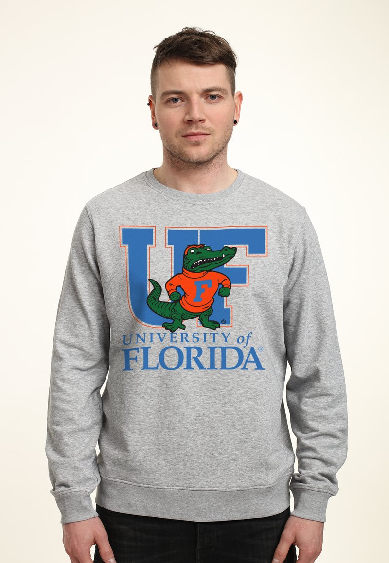 Grå sweatshirt med en stor blå "UF" och texten "University of Florida", med en grön och orange alligator-mascotgrafik.