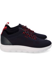 Black and navy mesh athletic shoes with red accents, feature a rounded white sole, and textured surface for breathability and support.