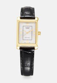 Gold rectangular quartz watch with a silver textured dial, black leather strap, and water-resistant feature. Arabic numerals at 12, 3, 6, and 9.