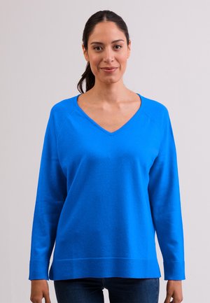 Blauwe V-hals trui met lange mouwen, gemaakt van zacht materiaal, met geribbelde boorden en zoom voor een comfortabele pasvorm.