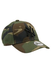 Camouflage baseball cap in green and brown, featuring an embroidered black logo on the front, a curved visor, and adjustable strap.