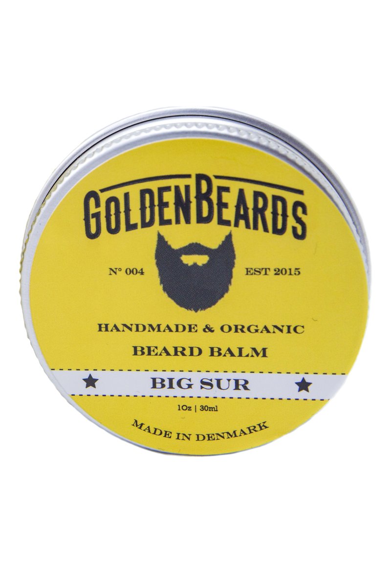 Gul metallburk med skäggbalsam med svart text. Etiketten läser "Golden Beards", "Handgjord & Ekologisk" samt "Big Sur." 30 ml storlek anges.