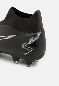 Puma Scarpe da calcio per terreni duri - black