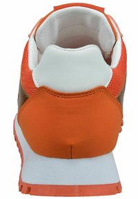 Sports shoe with a rounded heel, orange and white materials, mesh and textured accents, cushioned collar, and flexible rubber sole.