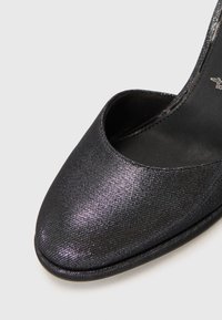 Black, textured peep-toe shoe with a shimmering finish and a smooth inner lining, featuring a rounded toe and subtle stitching details.