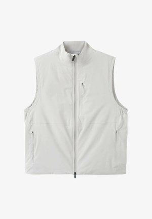 Jasnoszara kamizelka bez rękawów z pełnym zamkiem z przodu, wysokim kołnierzem oraz trzema kieszeniami na zamek – jedną na piersi i dwiema po bokach.