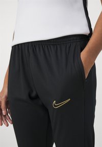 Nike Performance ACADEMY PANTS - Treningo apatinė dalis - black/metallic gold