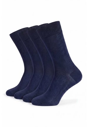 Four pairs of plain dark blue crew socks, aligned side by side on a white background.