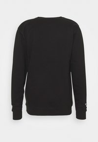 Felpa nera con maniche lunghe, collo a giro e polsini a costine. Struttura liscia senza motivi visibili. Design semplice e minimalista.