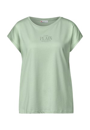 Světl zelené bavlněné tričko s krátkými rukávy, kulatým výstřihem a potiskem "Docela OBYČEJNÉ" v kontrastní barvě. Jednoduchý design.