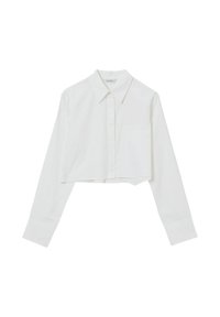 Camicia bianca cropped in tessuto morbido, con colletto classico, taschino frontale e maniche lunghe con polsini abbottonati.
