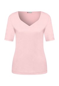 Top de manga corta rosa claro con escote en V y silueta ajustada.