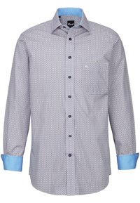 Camicia a maniche lunghe azzurro chiaro e bianca con un motivo geometrico, chiusura con bottoni frontale e polsini azzurro chiaro a contrasto. Presenta una tasca sul petto.