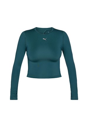 Top scurt cu mâneci lungi dintr-un material teal, cu o textură netedă. Are un decolteu rotund și un mic logo Puma aurit pe piept.