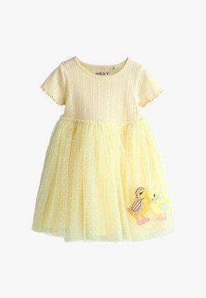 Gelbes Kleid mit kurzen Ärmeln, geripptem Oberteil und mehrlagigem Tüllrock. Mit gestickten Enten unten rechts. Tupfen auf dem Tüll.