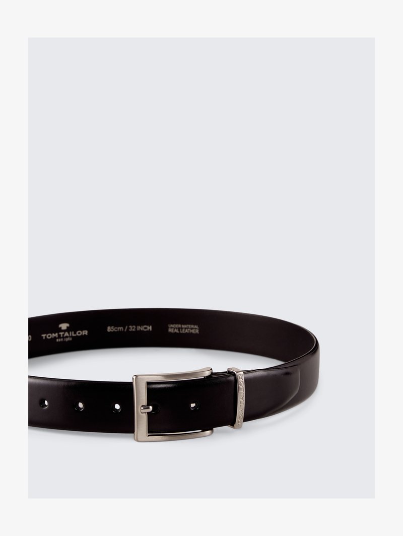 Black leather belt with a silver metal buckle and engraved logo, featuring five holes for adjustment. Length: 85 cm (32 inches).