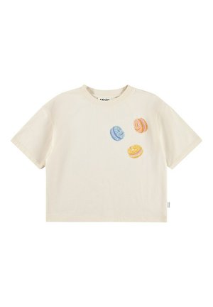 T-shirt a maniche corte color crema in cotone, con macarons ricamati in blu, arancione e giallo sul davanti.