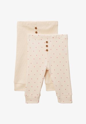 Deux paires de leggings beige pour bébé, une avec de petits cœurs roses et trois boutons marron sur la ceinture devant, l'autre unie avec deux boutons.
