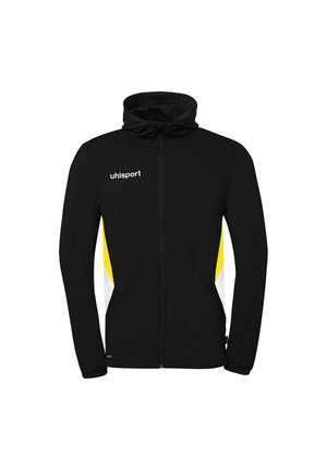 Schwarze Sportjacke mit durchgehendem Reißverschluss und Kapuze, gelben und weißen Seitenteilen sowie dem Logo "uhlsport" auf der linken Brustseite.