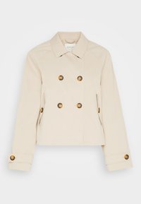 Chaqueta cropped beige de doble botonadura con botones en tono dorado, cuello puntiagudo y bolsillos laterales. Tejido suave con un diseño estructurado.
