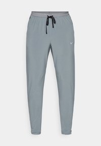STRIDE - Tracksuit bottoms - smoke grey/reflective silver