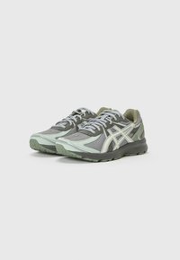 Sport shoes with a grey and mint mesh upper, light green accents, white logo details, and a textured rubber sole for traction.