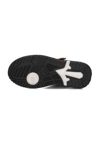 Black and white rubber shoe sole with textured tread pattern and circular design near the heel, shown against a plain white background.