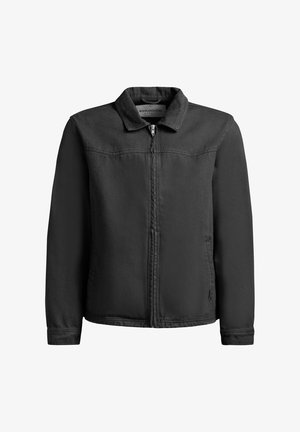 Schwarze Jacke mit einem durchgehenden Reißverschluss, Kragen, langen Ärmeln und sichtbaren Nähten, dargestellt vor einem weißen Hintergrund.