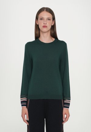 Green knit sweater with a round neckline, long sleeves, and patterned cuffs featuring horizontal stripes in various colors.
