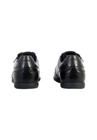 Schwarze Lederschuhe mit glatter Oberfläche, runder Form und niedrigem Gummi-Sohle. Mit einem Reißverschluss an jeder Seite für einfachen Einstieg.