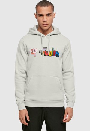 Light gray hoodie with a kangaroo pocket, featuring multi-colored "2Y Studios" text in varied fonts across the chest. Soft, textured fabric.