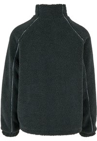 Black fleece pullover with a high collar, textured surface, and contrasting blue stitching along the seams. Features raglan sleeves.