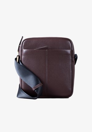 Brown leather crossbody bag with a textured finish, featuring a front pocket, a black adjustable strap, and clean, minimalist design.
