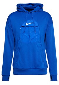 Haut de survêtement bleu Nike avec une poche kangourou à l'avant, une capuche avec cordon de serrage réglable, des poignets côtelés et un logo blanc sur la poitrine. Material doux.