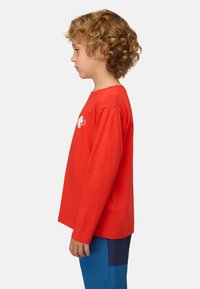 Rotes Langarm-T-Shirt aus Baumwolle mit einem weißen Elefanten-Print auf der Brust, gerippter Rundhalsausschnitt und lässiger Schnitt.