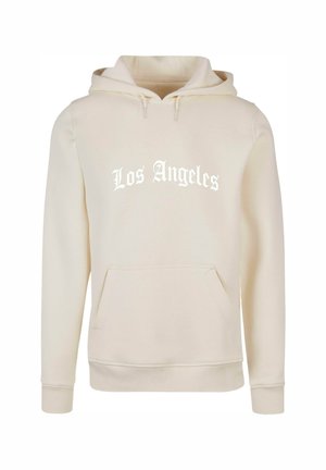Kreminė sweater's su priekinėmis kišenėmis, ant kurių parašyta "Los Angeles" baltu tekstu. Medžiaga atrodo minkšta, su raiščiais rankogaliuose ir apatinėje dalyje.