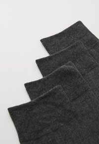 Dark gray socks with ribbed texture, featuring a smooth cuff. Three pairs stacked, displaying subtle variations in weave.