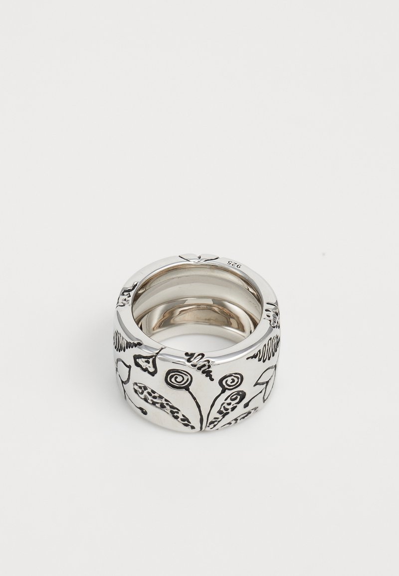 Wide silver ring with engraved abstract floral and swirl patterns, polished interior, and a "925" hallmark inside.
