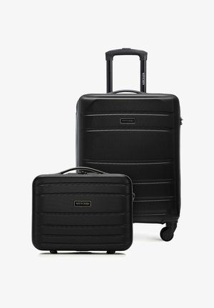 Deux valises rigides noires, une grande avec une poignée télescopique et des roues, et une plus petite avec une poignée supérieure, toutes deux étiquetées « Wittchen ».