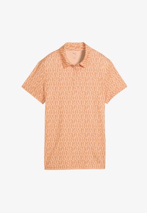 Koszulka polo z krótkim rękawem w jasno brzoskwiniowym kolorze z abstrakcyjnym wzorem w ciemniejszym odcieniu brzoskwini. Posiada kołnierzyk i rozpinane na trzy guziki.