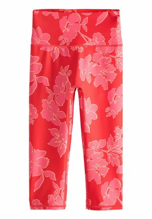Bright coral high-waist cropped leggings with large pink floral print and flatlock stitching for activewear.