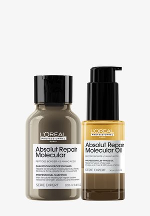 Zwei L'Oréal Professionnel Absolut Repair Molecular Haarpflege-Flaschen, ein Shampoo und ein molekulares Öl mit schwarzen Verschlüssen und weißen Etiketten.