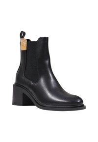 Botín de piel negra hasta el tobillo con puntera redonda, paneles laterales elásticos y un acento de corcho en el tacón. Presenta un tacón de bloque y una textura suave.