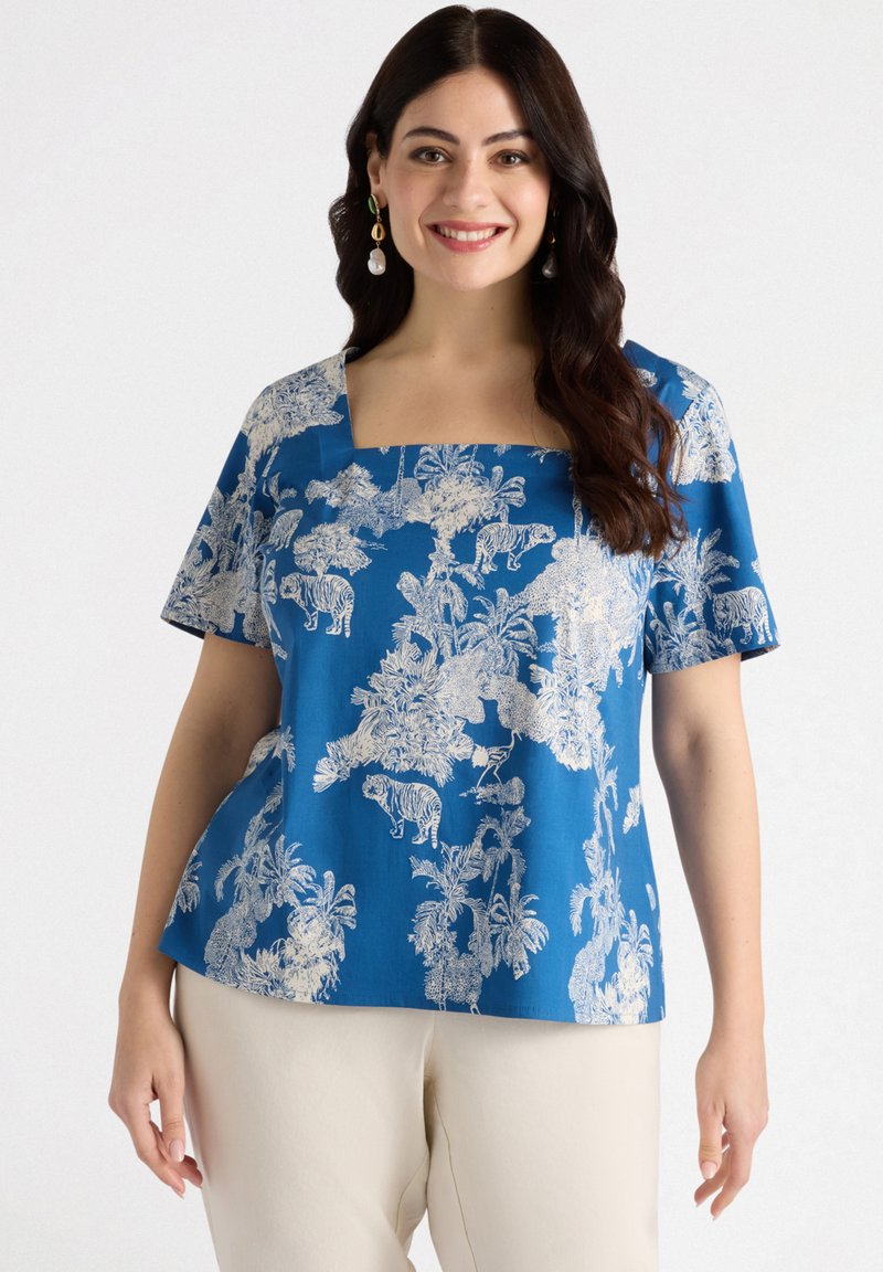 Blue short-sleeve top featuring a square neckline, white animal and botanical print, and a relaxed fit. Smooth cotton fabric.