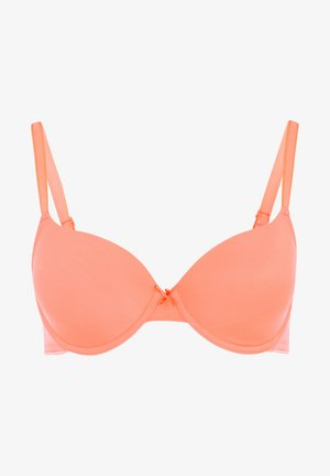 Peach-colored bra with smooth, molded cups, adjustable straps, and a small decorative bow at the center. Lightweight fabric.